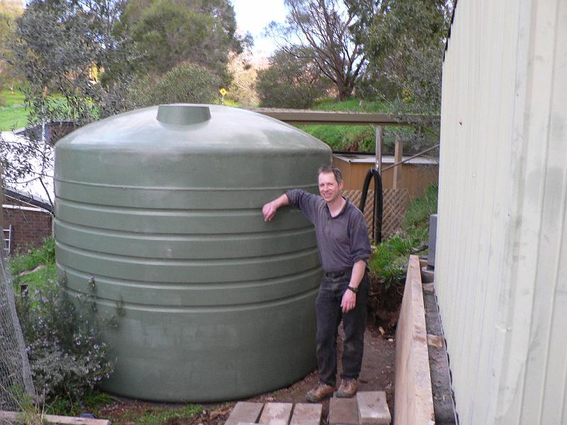 P1010099.JPG - Tank in place. Shed survived the return journey. Part 1 complete. Now I guess we need water in... and water out... digging, plumbers, electricans...